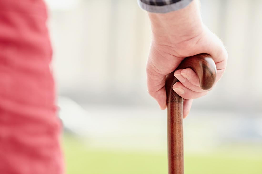 older person with a cane