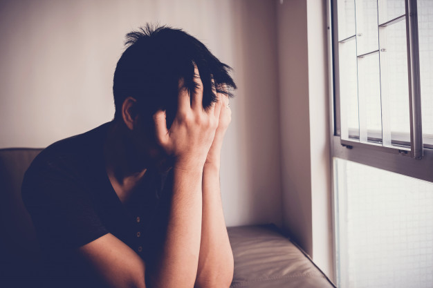 depressed despair anxiety young man sitting alone home mental health men health concept 49149 1215